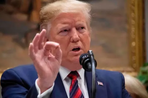 Trump threatens Time journalist with prison over photo