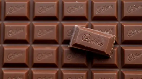 Matt Cardy/Getty Images A large slab of several squares of Cadbury chocolate.