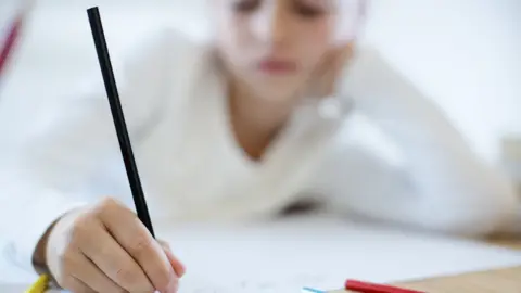 Thinkstock girl writing