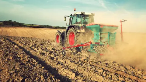 Getty Images A tractor ploughing a field