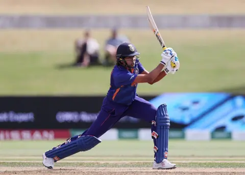 Getty Images Jhulan Goswami of India bats during the 2022 ICC Women's Cricket World Cup match between England and India at Bay Oval on March 16, 2022 in Tauranga, New Zealand