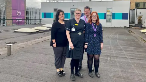 NHS Somerset Consultant Anaesthetist Bozena Lassota-Korba, Elective Care Matron Kelly Hutchins, Orthopaedic Consultant Mr Matt Hall and Operational Service Manager Cara O'Keefe at the planned site for the new ward at Yeovil District Hospital