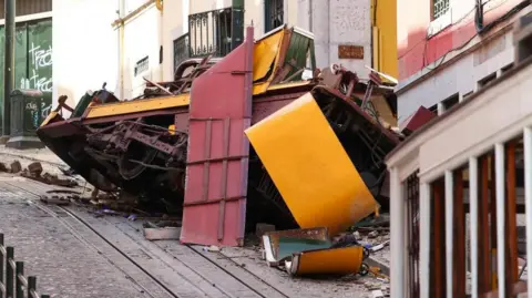 The wreckage of the Gloria funicular in Lisbon