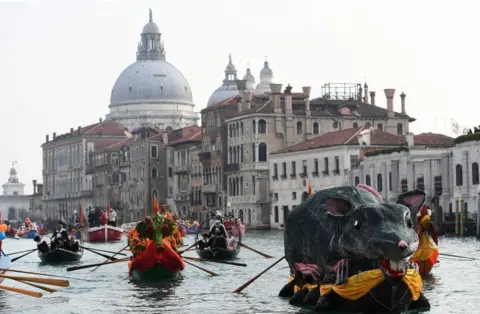 AFP The "Pantegana" (Big Rat) sails on the Grand Canal with other decorated boats for the traditional regatta which officially opens the Carnival in Venice