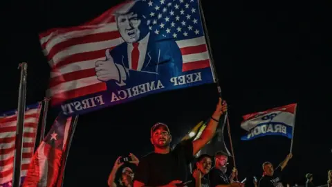 Getty Images Supporters of Donald Trump flocked to his Mar-a-Lago home on Monday night as news of the FBI search broke