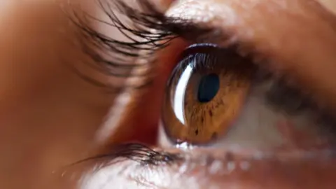 Getty Images A close-up of an eye. It is hazel in colour