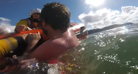 Alex Hodson being rescued by RNLI