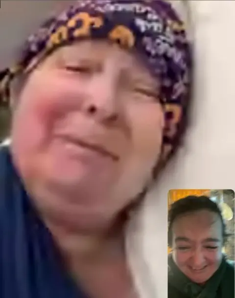 Ashley Storrie Janey Godley on a Facetime grab. Janey is in her hospital bed with a scarf around her head. Her daughter is in an inset box looking tearful