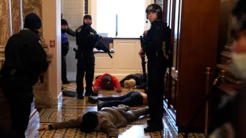 Getty Images Capitol police detain protesters inside the building