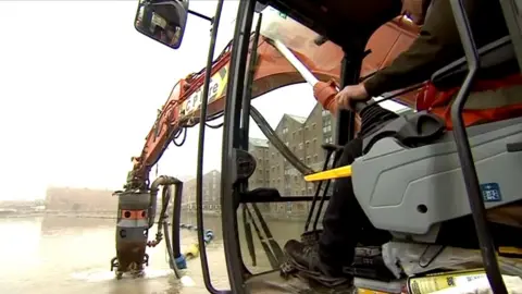 Digger working in Gloucester Docks