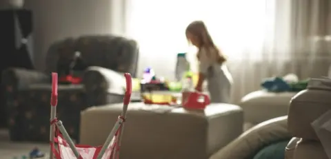 Getty Images An unidentified child plays alone