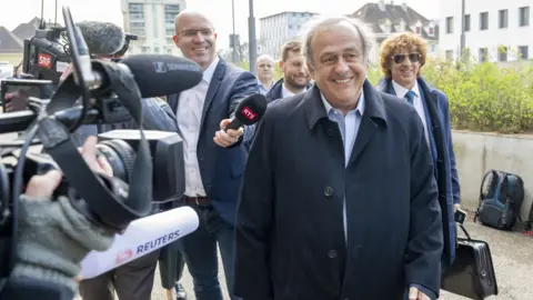 Reuters Former UEFA President, Michel Platini (C) arrives to the hear the trial verdict at the special appeals court in Muttenz. 