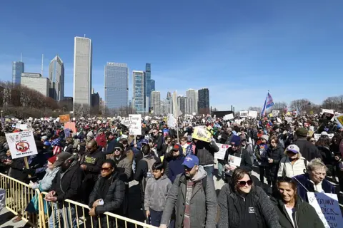Getty Images People are seen gathered at a park in Chicago against the Trump administration 