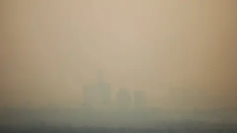 Getty Images Buildings are seen through the air pollution during a day where Mexico City's authorities have activated a contingency plan due to bad air conditions on May 14, 2019 in Mexico City