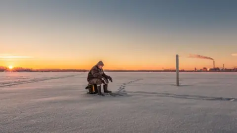 veeohutus.ee Angler on frozen lake, Estonia