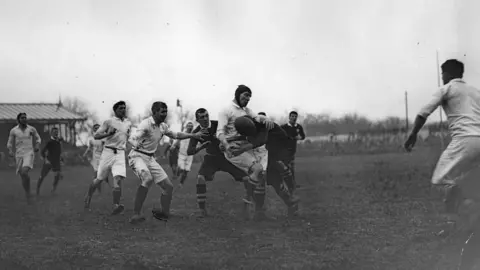 Getty Images A tackle goes in during England v Wales