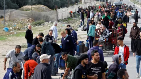 Reuters People queuing for cooking gas in Rafah