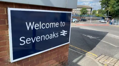 Getty Images A sign that reads 'Welcome to Sevenoaks', with a car park in the background.