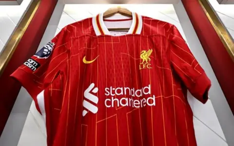 Getty Images Liverpool FC shirt with Standard Chartered branding