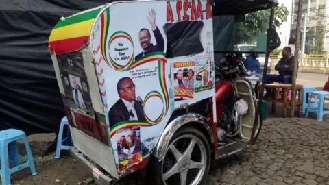 Getty Images Posters of Ethiopian Prime Minister Abiy Ahmed are seen on a tuc-tuc in Addis Ababa, Ethiopia on November 07, 2018