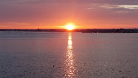 WEDNESDAY - A sunset over water photographed in Poole