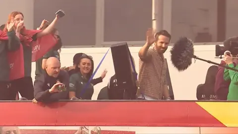 Ryan Reynolds on victory parade bus