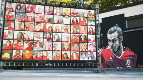 Welsh fans sing their hearts out with BBC National Orchestra of Wales in support of Wales at Euro 2020.