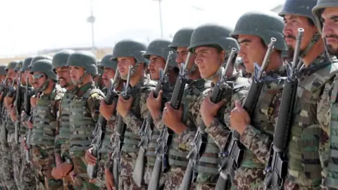 EPA Afghan soldiers attend their graduation ceremony in Herat, Afghanistan, 03 October 2017