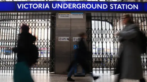EPA Commuters at a locked Victoria station