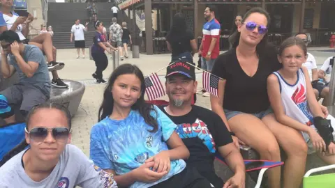 John Calacan, centre, with daughters Selah, Aniah and Neveah, and wife Christina