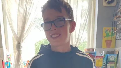 Family handout Joel supports his younger brother Reece by describing objects for him