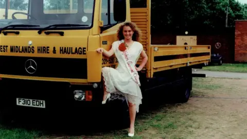 Tipton Carnival Queens Shine Again / Erik Kessels Tipton Carnival Queen posing next to haulage truck