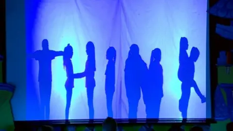 BBC Silhouetted children form the word "Think"