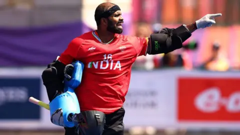 Getty Images Sreejesh Parattu Raveendran of Team India reacts during the Men's Hockey - Gold Medal Match between Australia and India on day eleven of the Birmingham 2022 Commonwealth Games at University of Birmingham Hockey & Squash Centre on August 08, 2022 on the Birmingham, England.