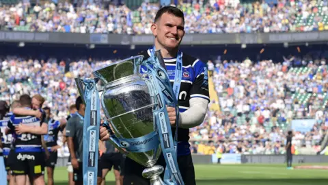 Ben Spencer holding the Premiership trophy