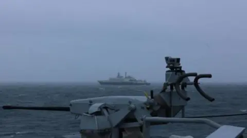 Ministry of Defence A handout photo from the Ministry of Defence showing the Yantar on the horizon