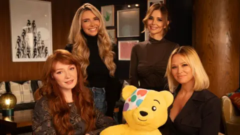 Girls Aloud with a Pudsey Bear cuddly toy