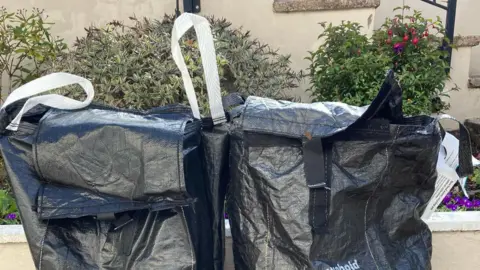 Facebook/LDRS The new bin bag, left, is no different from the old bin bag apart from the colour of the handles