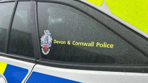 The side of a Devon and Cornwall Police vehicle.