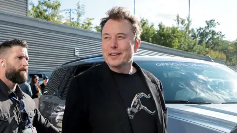 Getty Images Elon Musk arriving at an event on 8 September. 