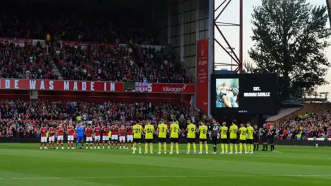 Getty Images Minute's applause in memory of Nottinghamshire Police Officer, SGT. Graham Saville during the Carabao Cup 2nd Round match between Nottingham Forest and Burnley at the City Ground, Nottingham on Tuesday 29 August 2023