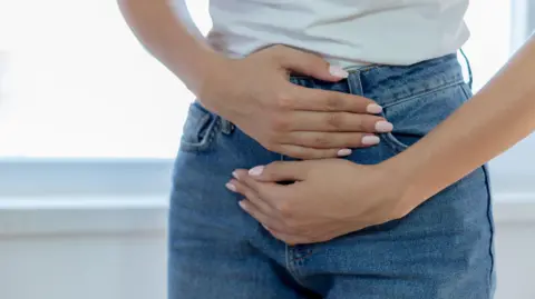 Stock image of a woman with menstrual pain.
