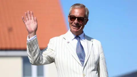 Britain's Reform UK party leader Nigel Farage arrives at his polling station for the Clacton by-election, triggered by his own resignation, in Walton-on-the-Naze, Essex, Britain, August 13, 2026. REUTERS/Toby Shepheard