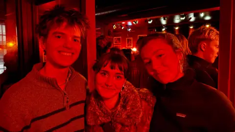 Students Luukas, Molly and Clara in the La Fontaine jazz club