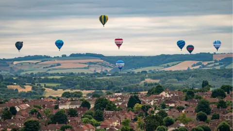 PA Media Hot air balloons over Bristol