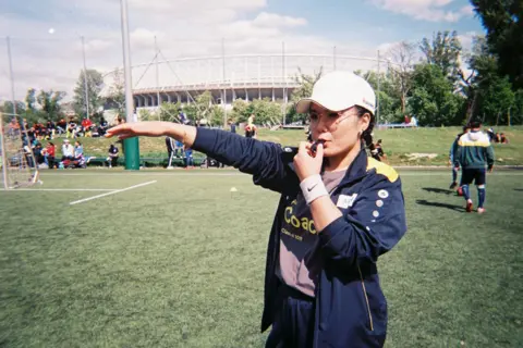 Saleha Kashfi A coach poses for the camera