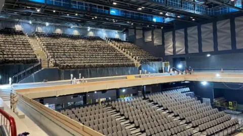 Large indoor arena with thousands of seats 