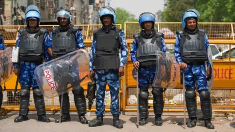 Rapid Action Force (RAF) personnel deployed after communal violence broke during a Shobha Yatra on Hanuman Jayanti, at Jahangirpuri, on April 17, 2022 in New Delhi, India.