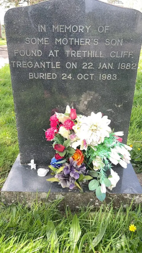 A gravestone which says "In memory of some mother's son found at Trethill cliff Tregantle on 22 Jan 1982"