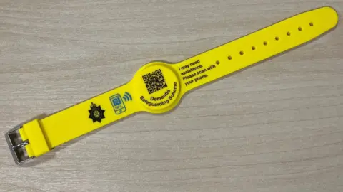 Wiltshire Police Dementia wristband laid out on a table